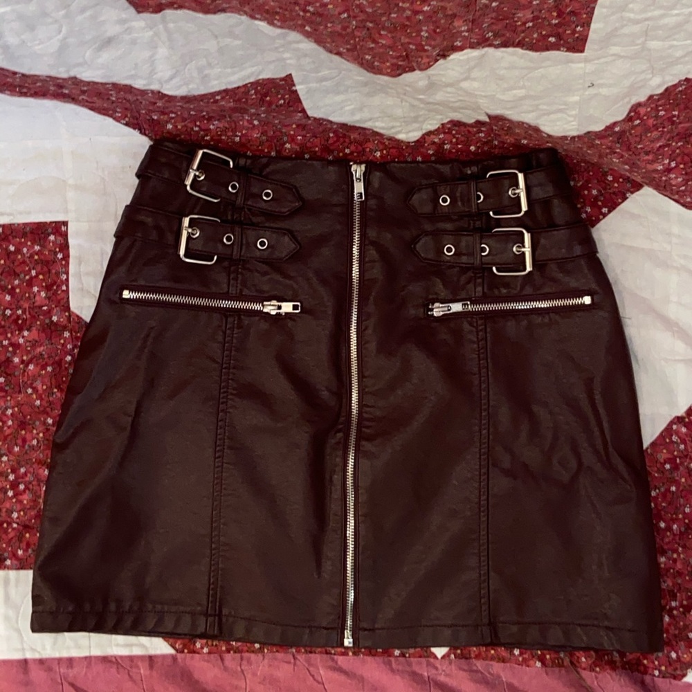 Pleather maroon skirt.